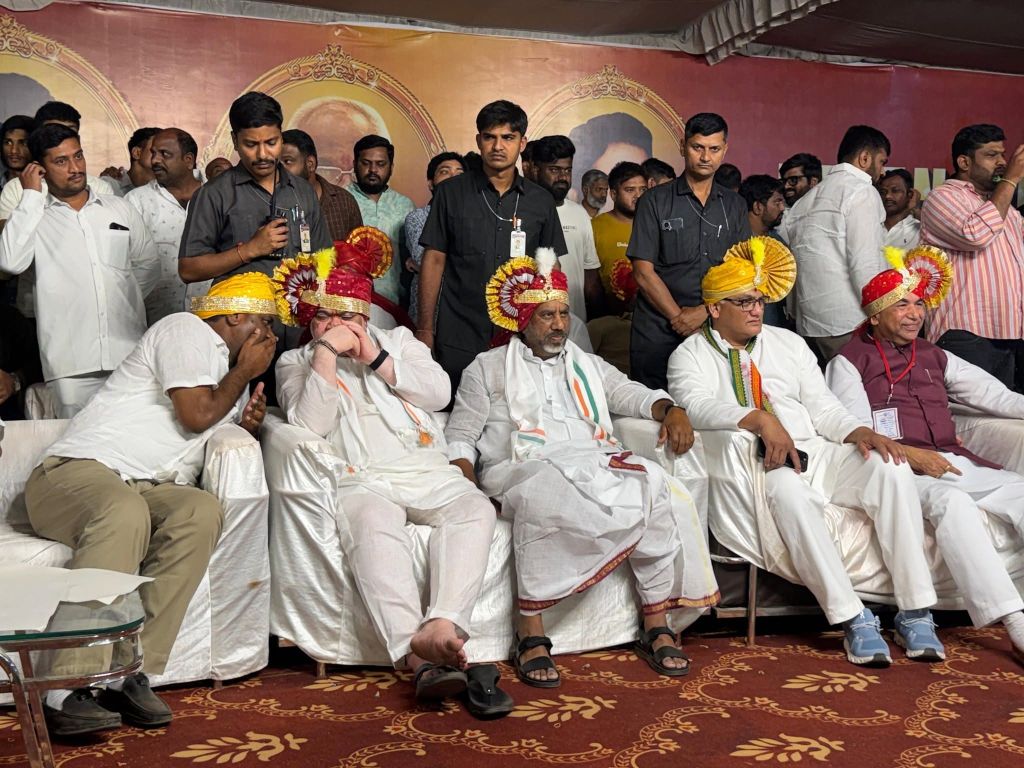 Gouri Satish seated with senior Congress leaders at a party gathering